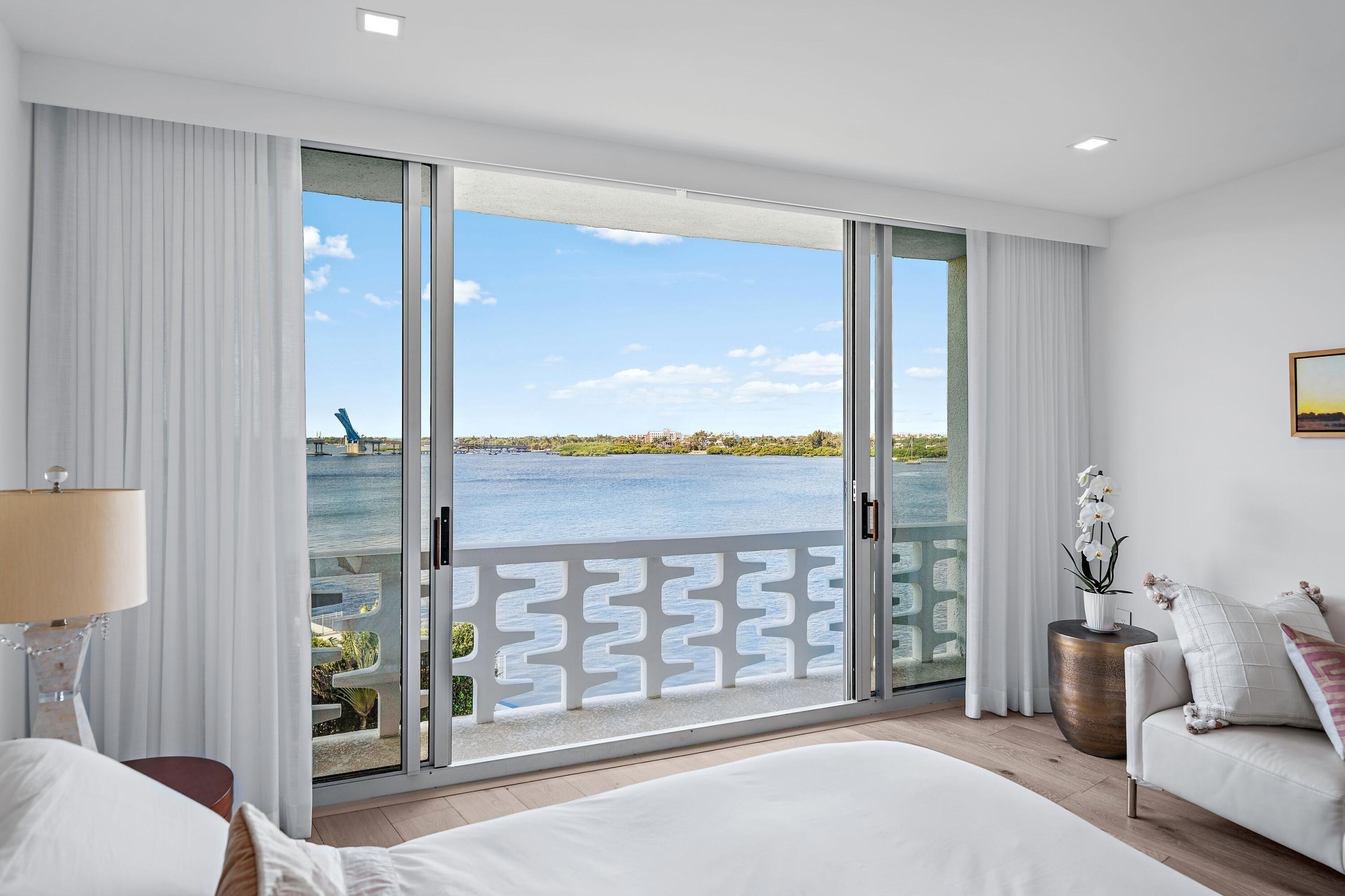2760 South Ocean Boulevard, Unit 508 Palm Beach, FL 33480 - Photo 13 of 26 a living room with furniture and a floor to ceiling window