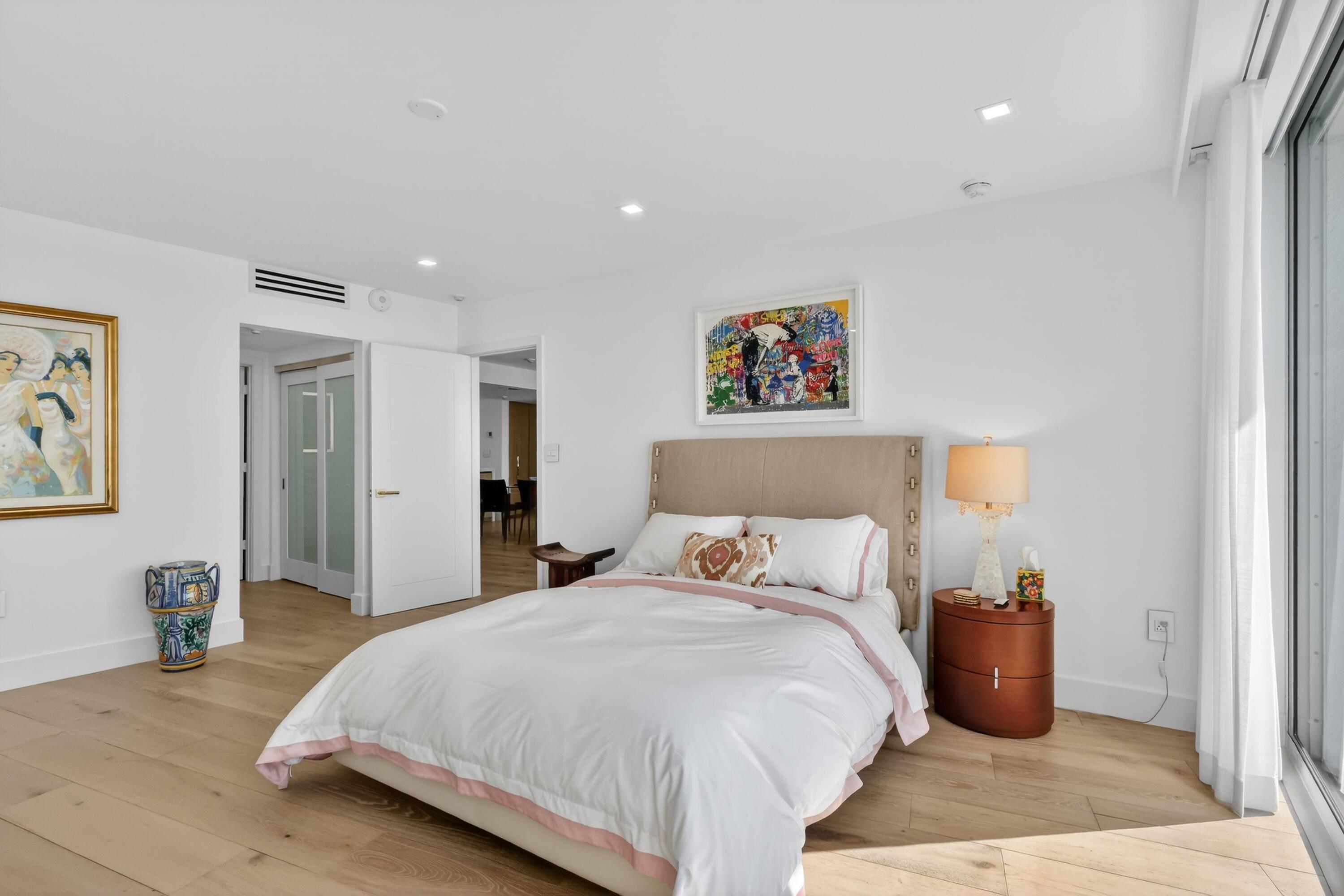 2760 South Ocean Boulevard, Unit 508 Palm Beach, FL 33480 - Photo 14 of 26 a bedroom with bed and a painting on the wall