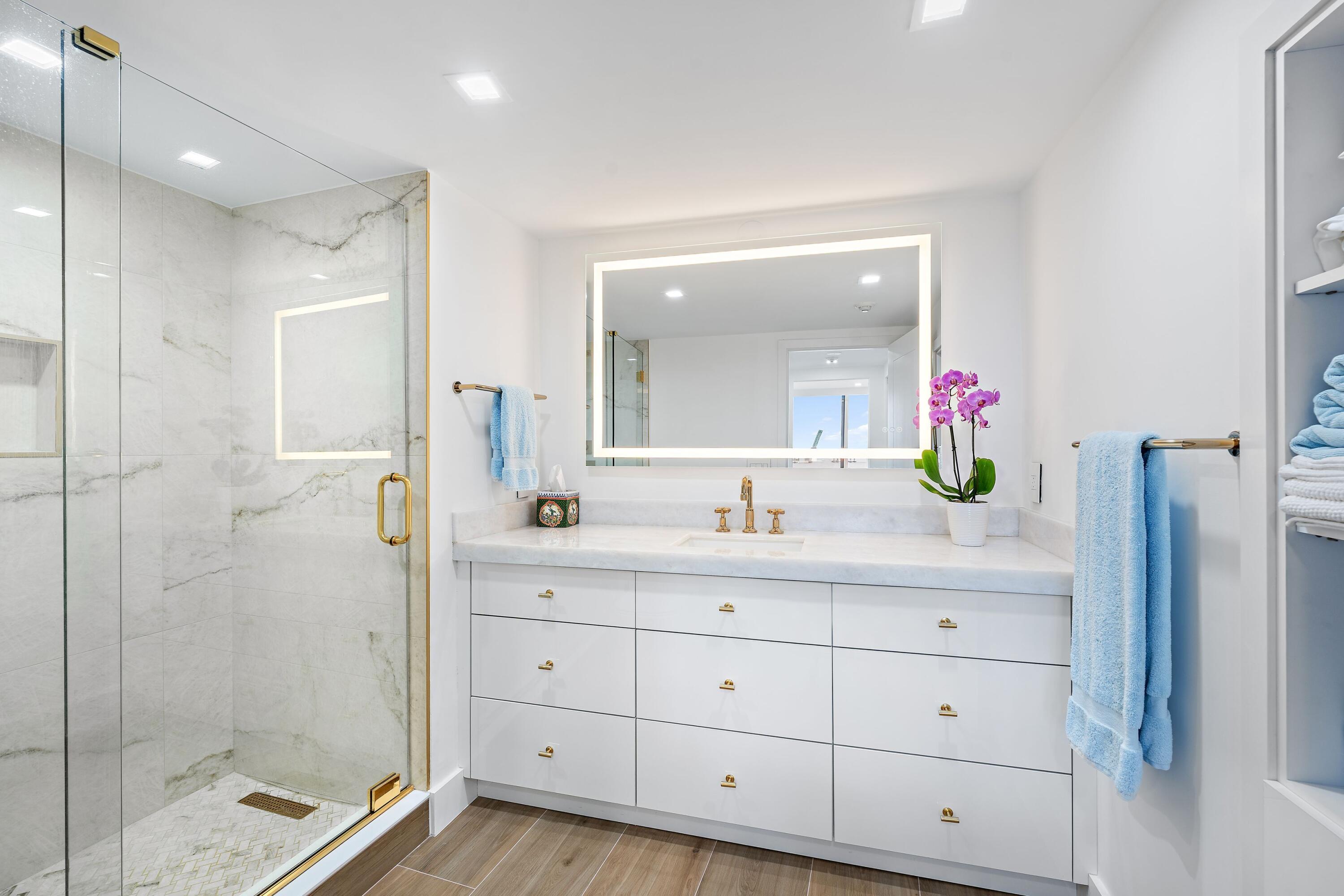 2760 South Ocean Boulevard, Unit 508 Palm Beach, FL 33480 - Photo 17 of 26 a bathroom with a shower sink and mirror