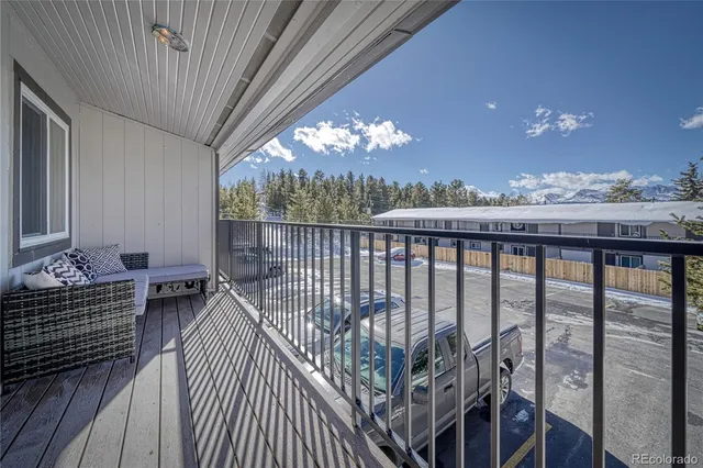 a view of balcony with furniture