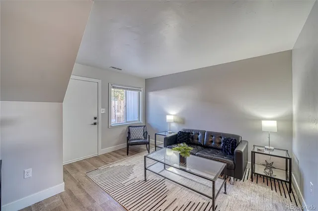 a living room with furniture and a rug