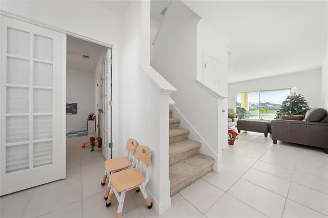 a living room with furniture and a chair