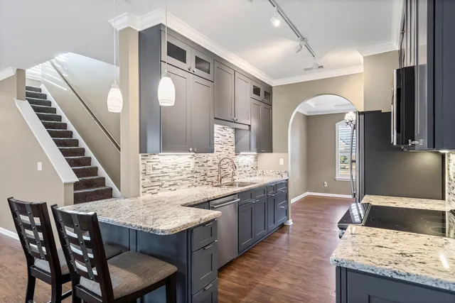 a kitchen with a table and chairs