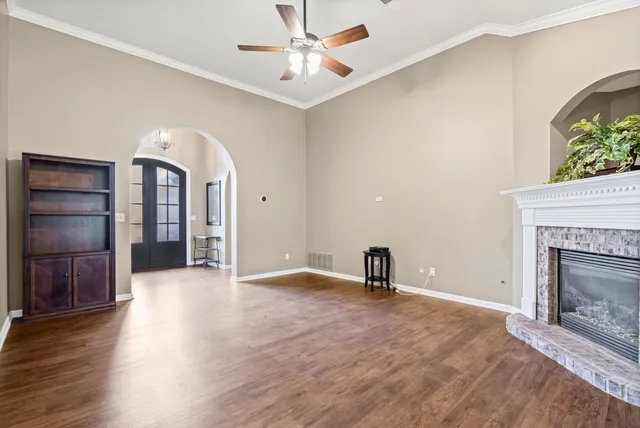 wooden floor in an empty room with a fireplace