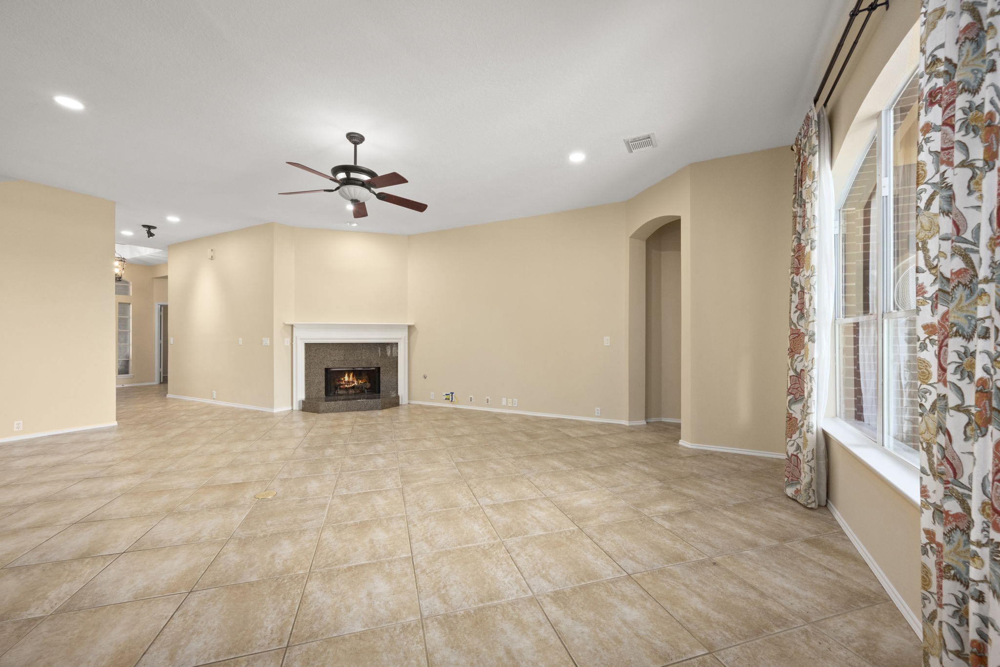 2007 Louetta Spring Drive Spring, TX 77388 - Photo 11 of 50 The heart of the home is this spacious family room, where oversized windows overlook the backyard oasis and a cozy fireplace creates the perfect gathering place year-round.