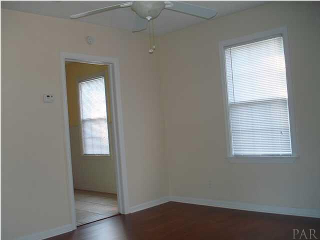 101 Ruberia Avenue Pensacola, FL 32507 - Photo 2 of 12 Living room with new laminate wood floor, fresh paint &new fan w/light.
