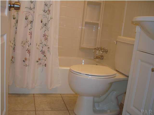 101 Ruberia Avenue Pensacola, FL 32507 - Photo 8 of 12 Tile floor & white bath fixtures.