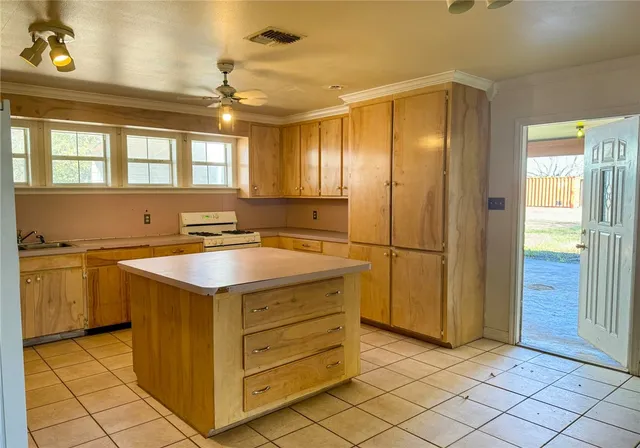 a view of a kitchen with storage and utility