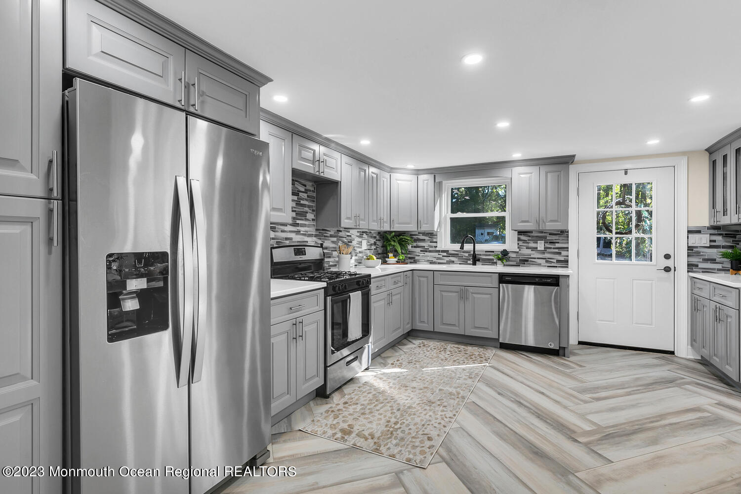 961 West Front Street Red Bank, NJ 07701 - Photo 11 of 46 a kitchen with a refrigerator a sink and cabinets