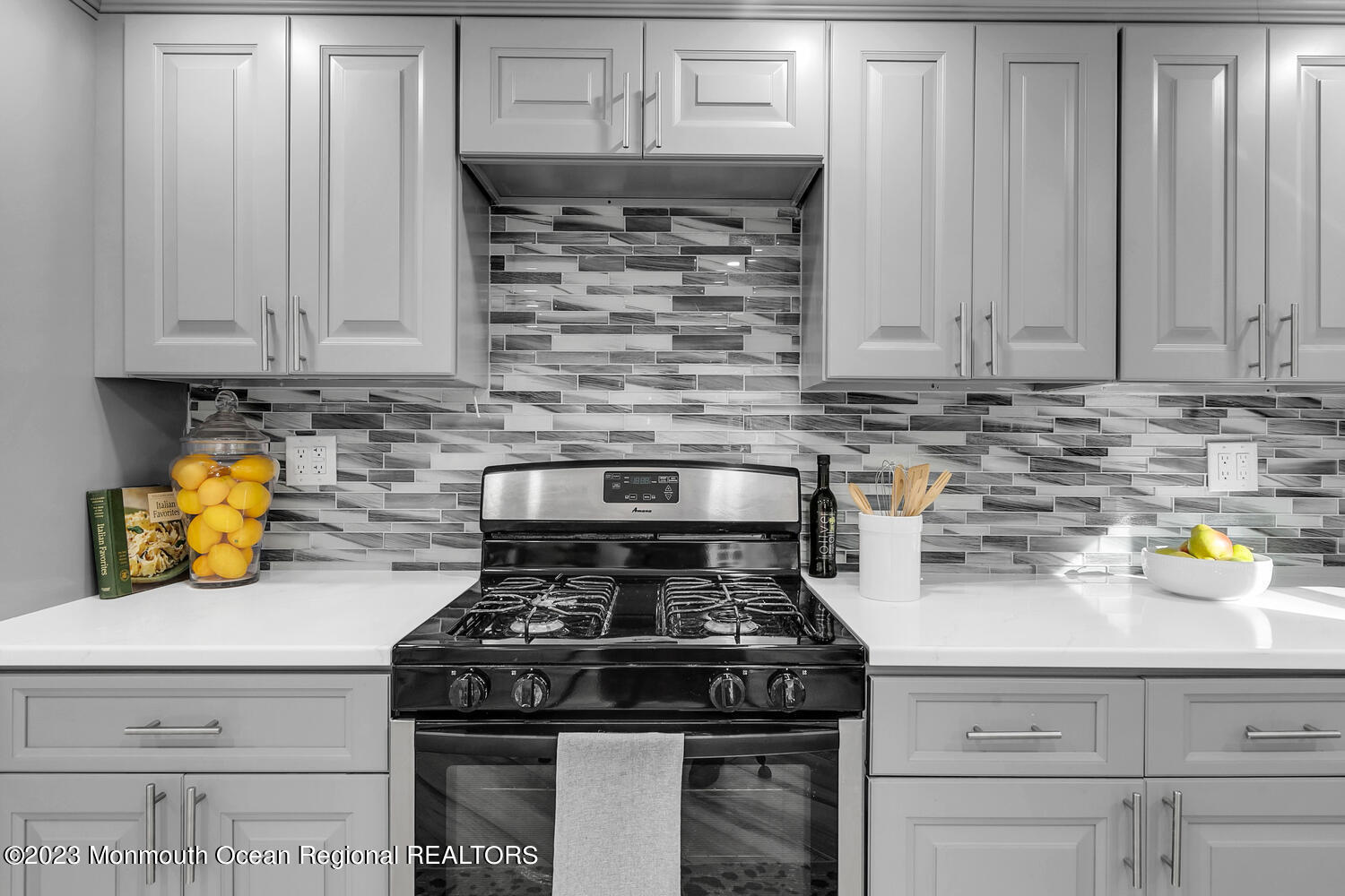 961 West Front Street Red Bank, NJ 07701 - Photo 12 of 46 a kitchen with a stove and white cabinets