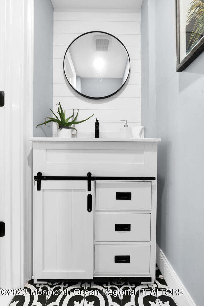961 West Front Street Red Bank, NJ 07701 - Photo 15 of 46 a bathroom with a sink a mirror and a shower