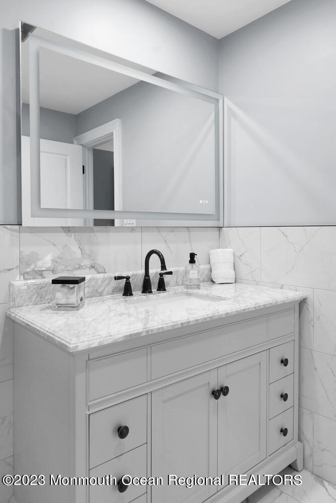 961 West Front Street Red Bank, NJ 07701 - Photo 28 of 46 a bathroom with a sink and a mirror