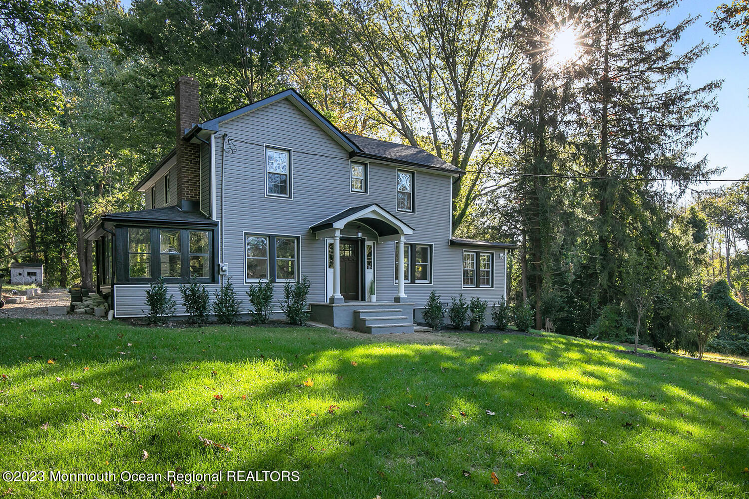 961 West Front Street Red Bank, NJ 07701 - Photo 46 of 46 a front view of a house with a yard and porch
