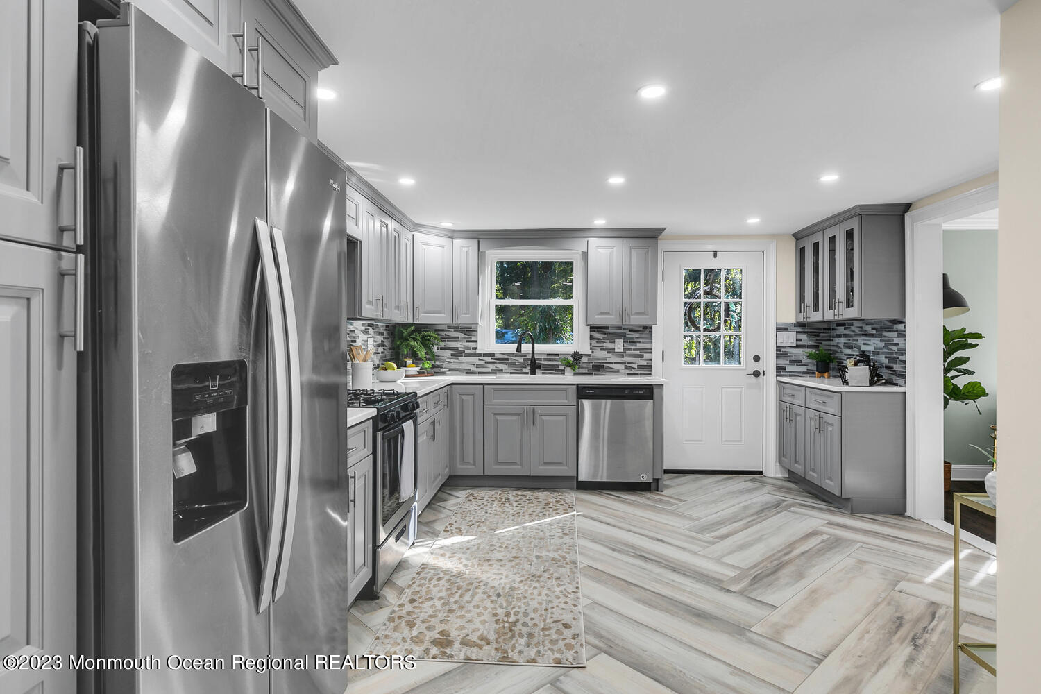 961 West Front Street Red Bank, NJ 07701 - Photo 10 of 46 a kitchen with granite countertop a refrigerator sink and cabinets
