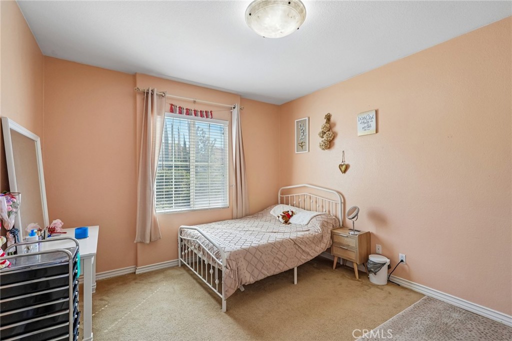 46101 Sharon Street Temecula, CA 92592 - Photo 26 of 34 a bedroom with a bed and a window