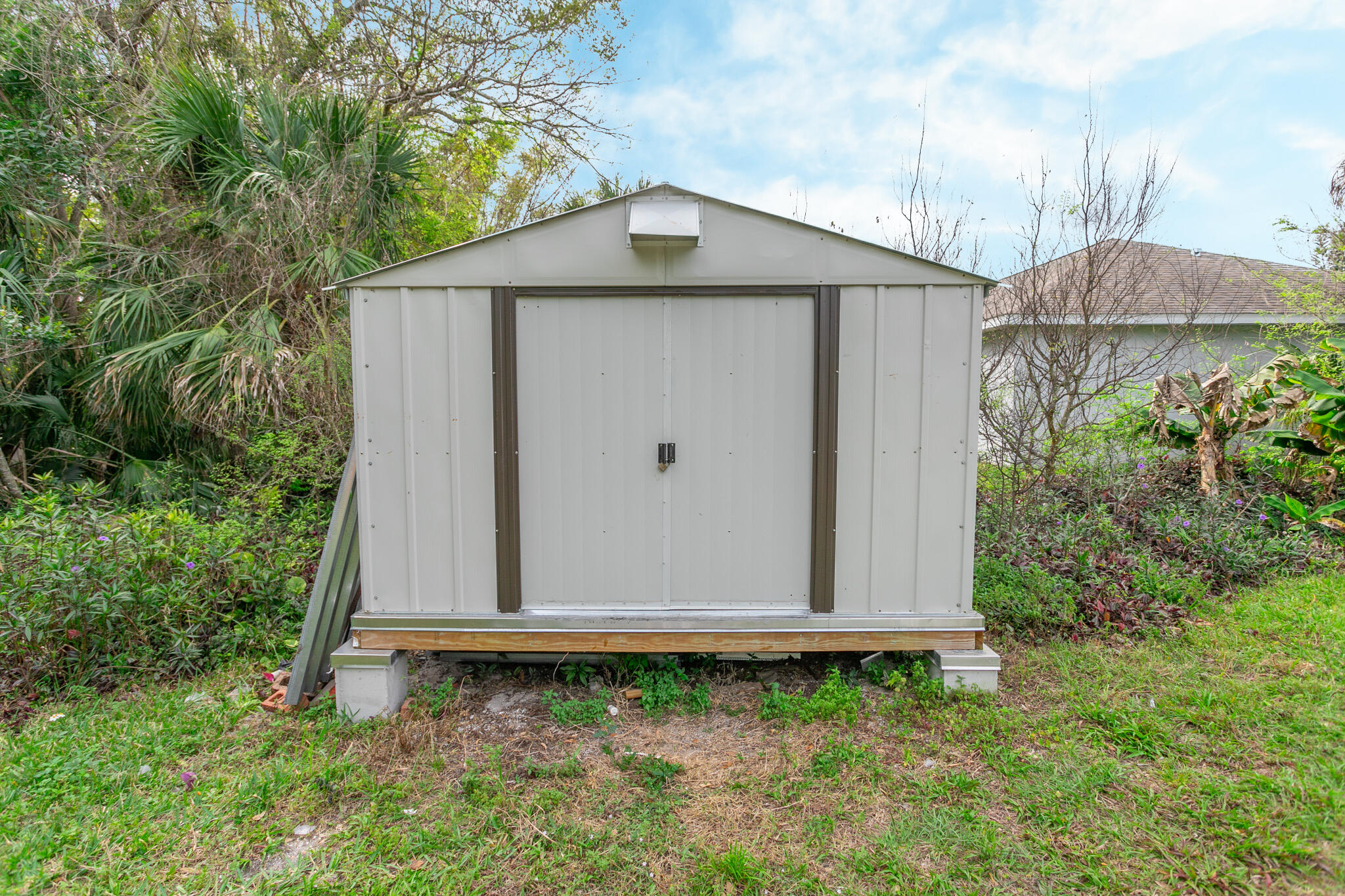441 Lucas Road Merritt Island, FL 32953 - Photo 16 of 17 a front view of a house with garden