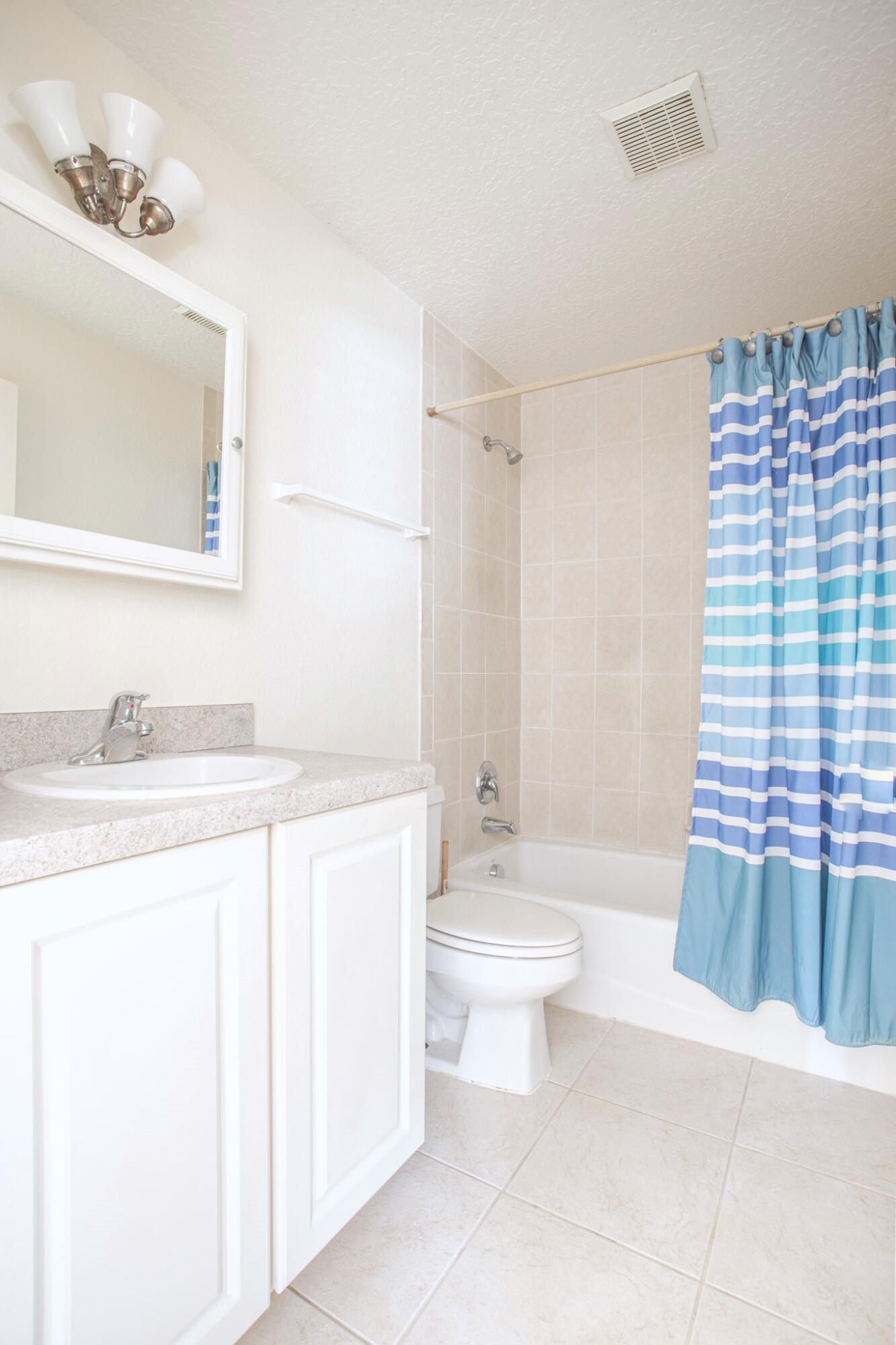 441 Lucas Road Merritt Island, FL 32953 - Photo 8 of 17 a bathroom with a sink a toilet and shower