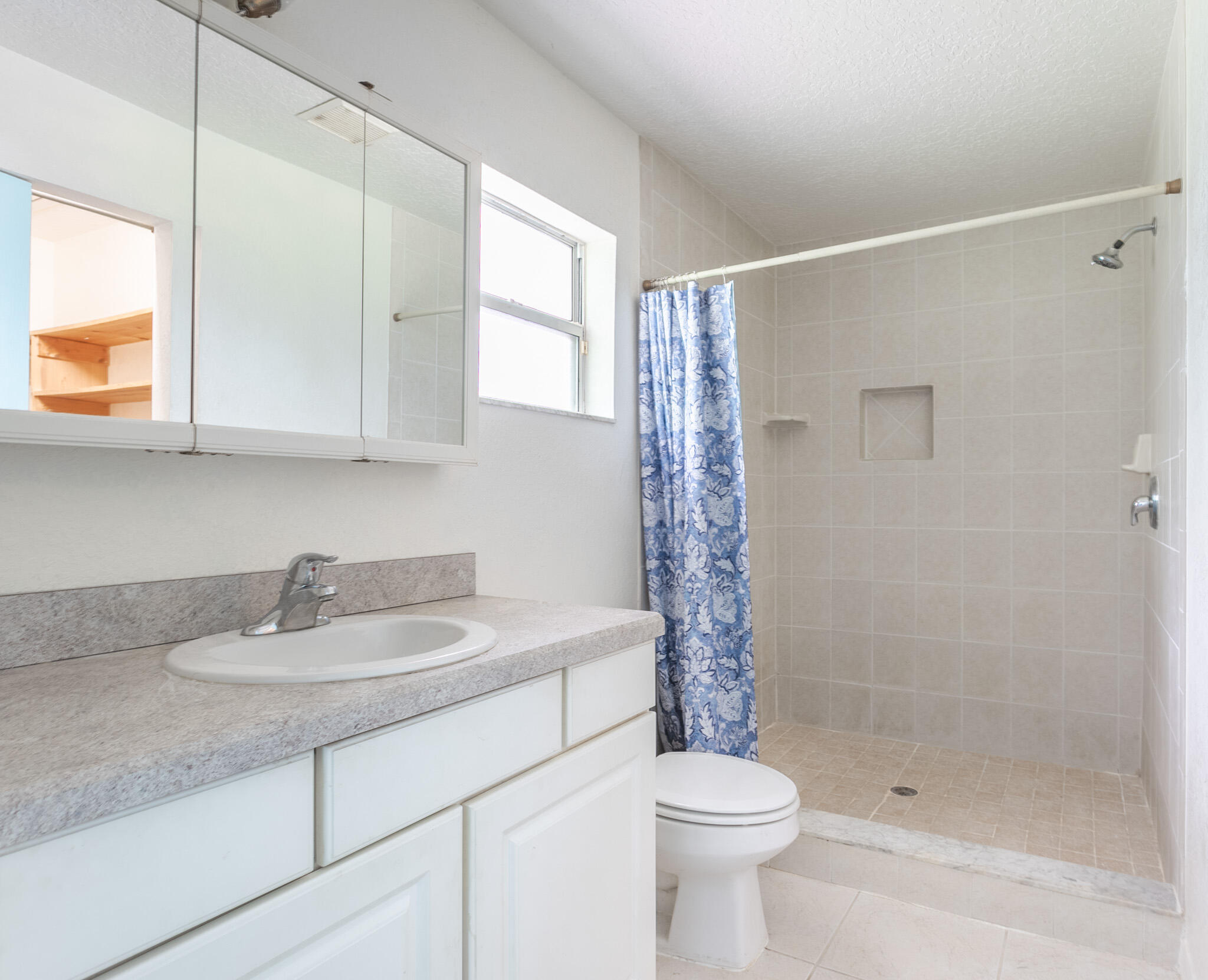 441 Lucas Road Merritt Island, FL 32953 - Photo 10 of 17 a bathroom with a sink a toilet and shower