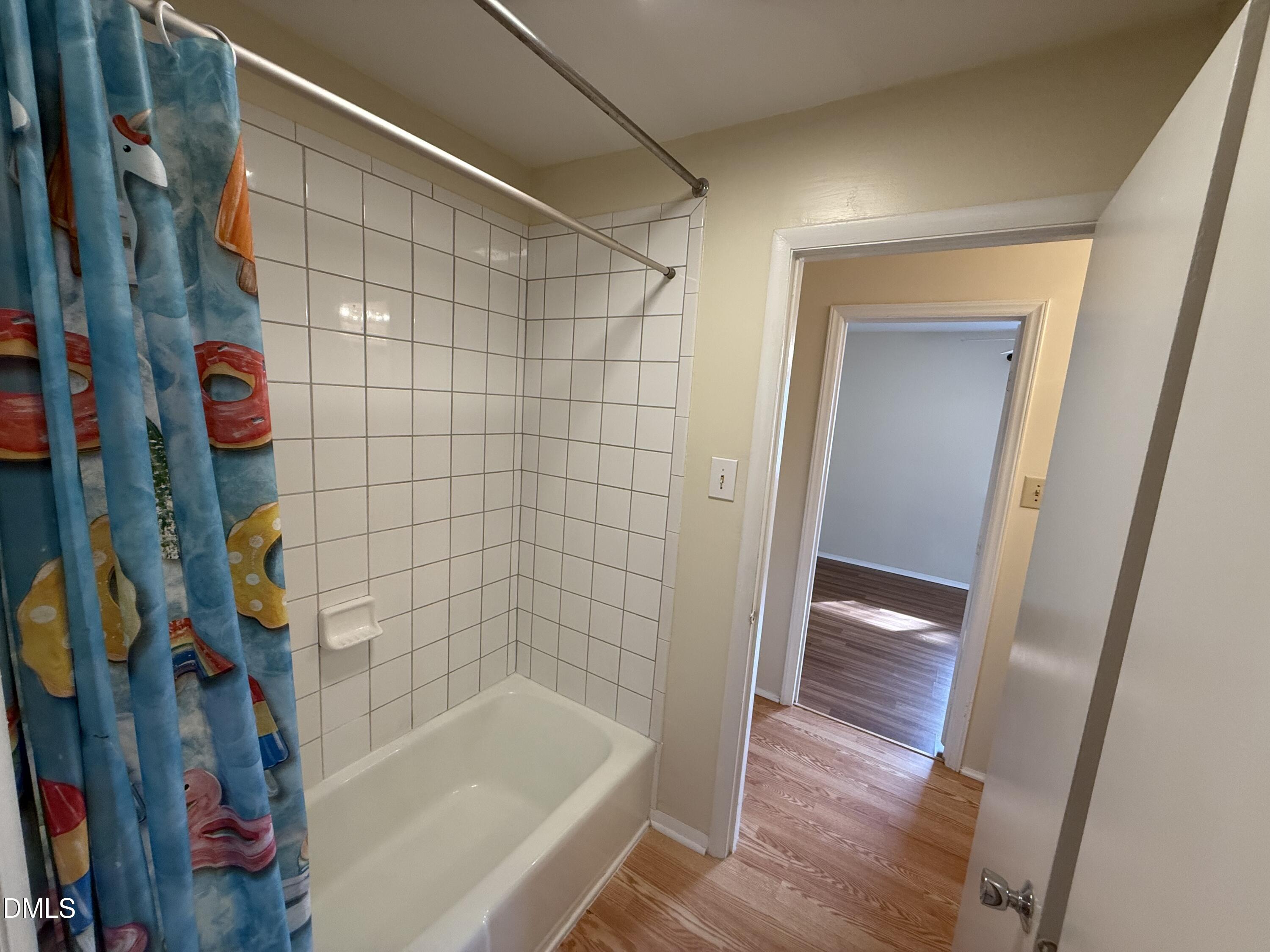 1228 Teakwood Place Raleigh, NC 27606 - Photo 22 of 30 a bathroom with a bathtub and shower