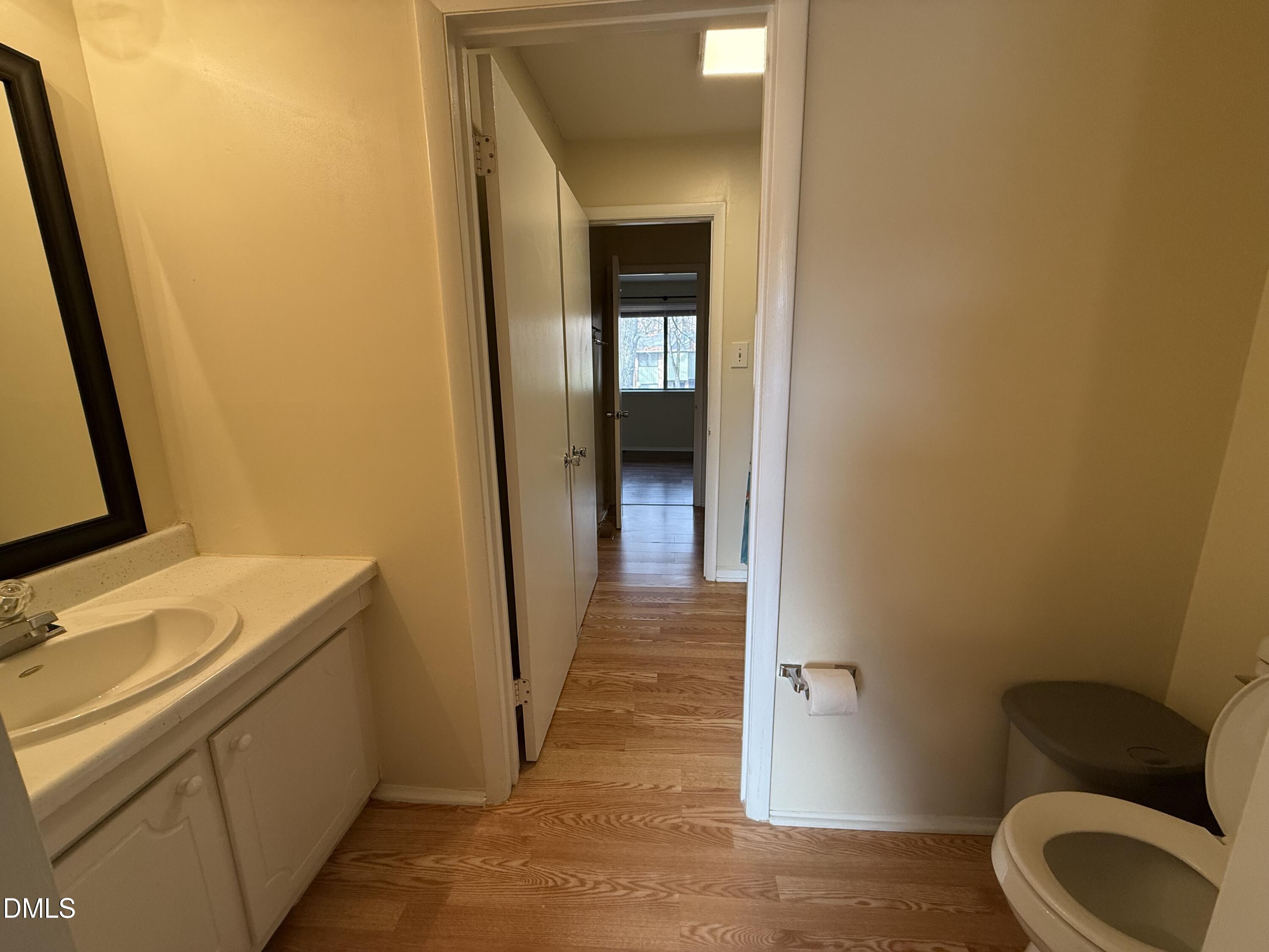 1228 Teakwood Place Raleigh, NC 27606 - Photo 25 of 30 a bathroom with a sink and toilet