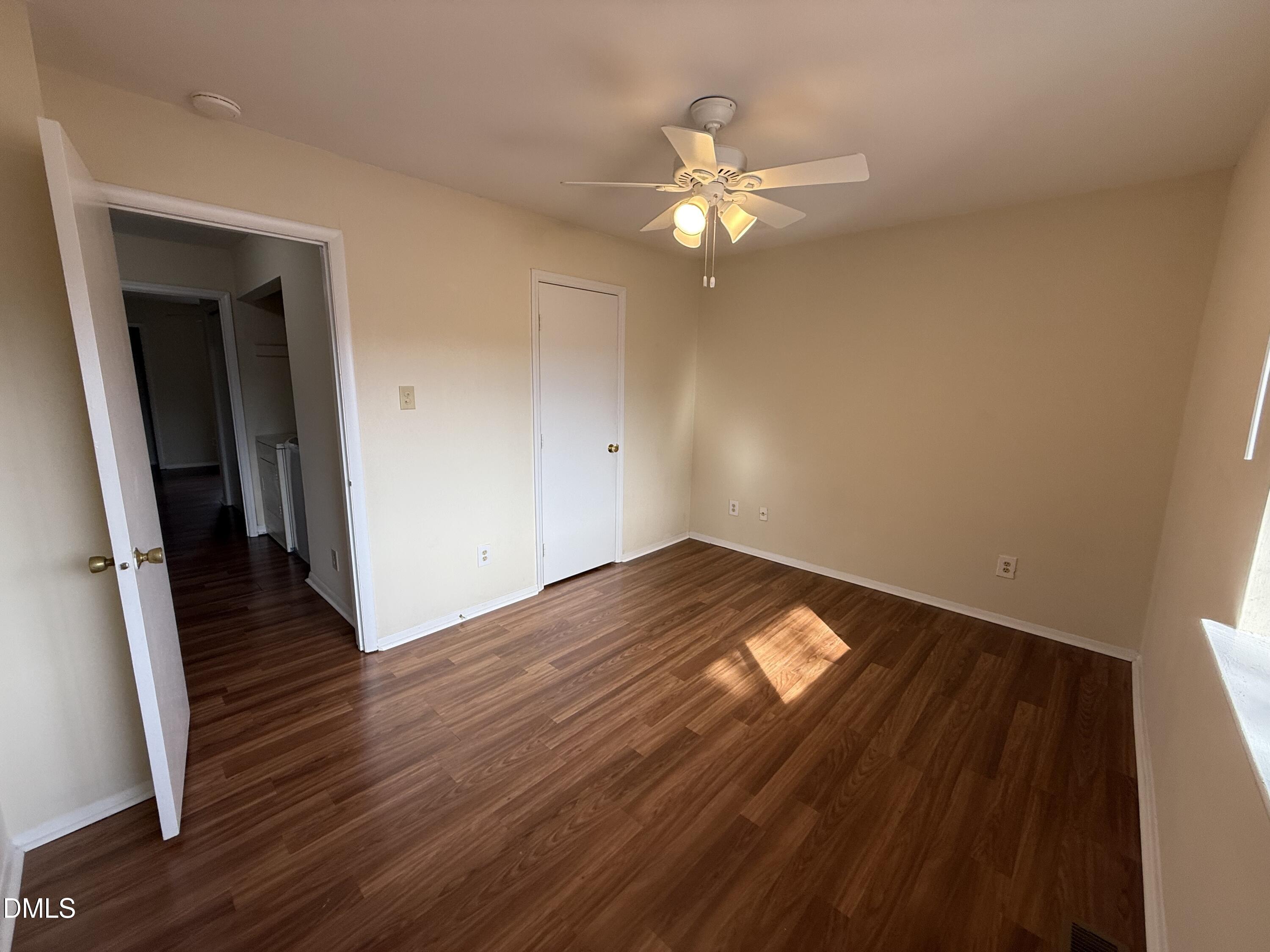 1228 Teakwood Place Raleigh, NC 27606 - Photo 27 of 30 a view of empty room with wooden floor