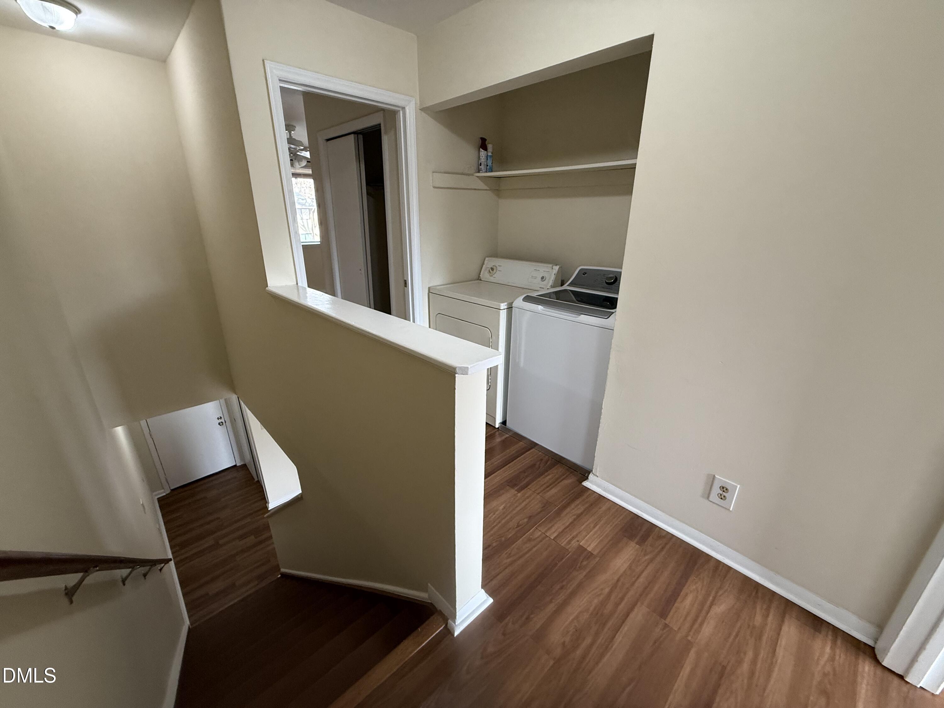 1228 Teakwood Place Raleigh, NC 27606 - Photo 29 of 30 an empty room with wooden floor and windows