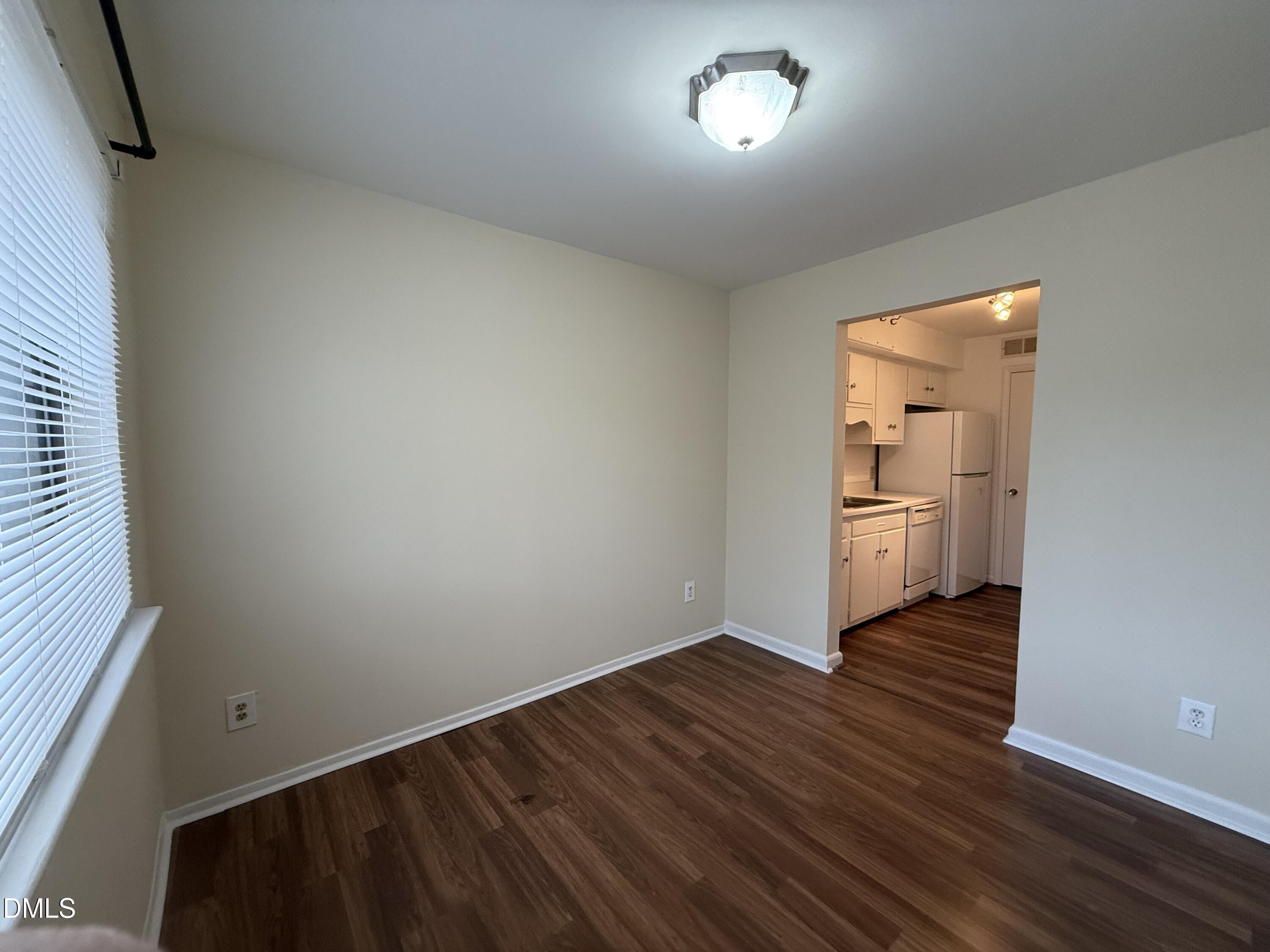 1228 Teakwood Place Raleigh, NC 27606 - Photo 30 of 30 a view of a room with wooden floor and a sink