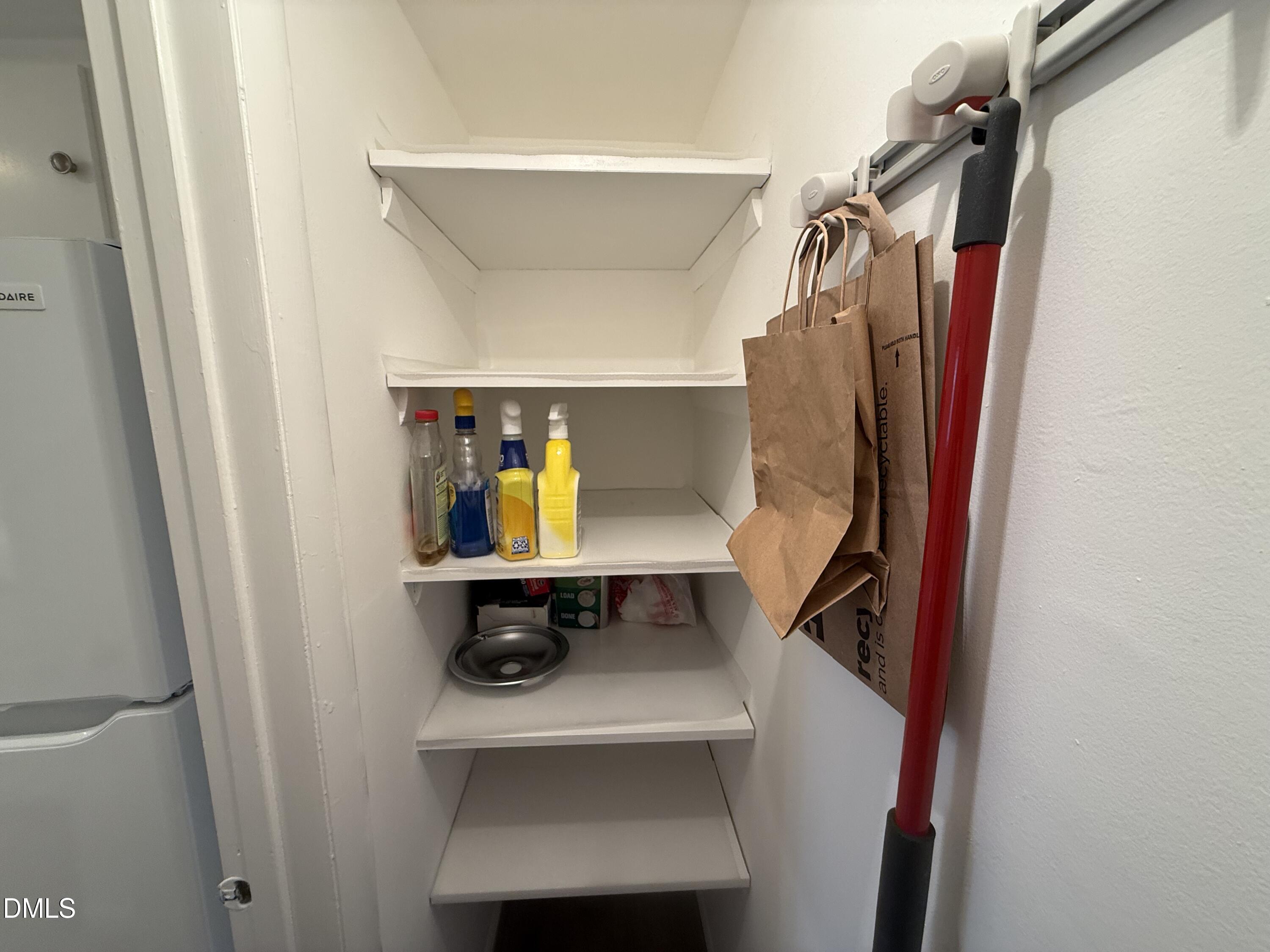 1228 Teakwood Place Raleigh, NC 27606 - Photo 9 of 30 a view of walk in closet with clothes