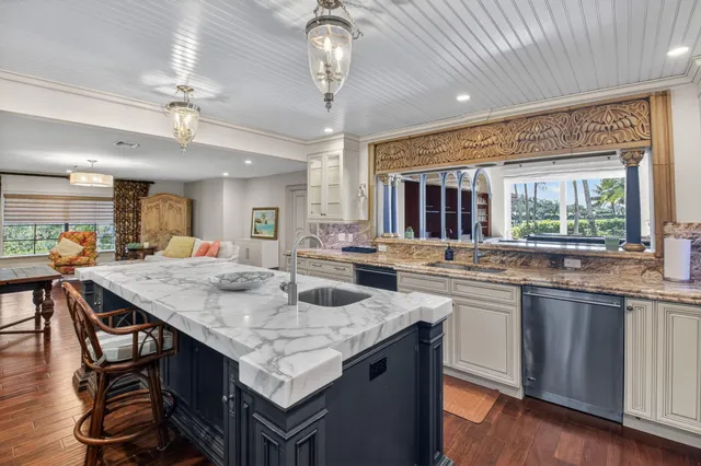 a living room with a fireplace furniture and a flat screen tv