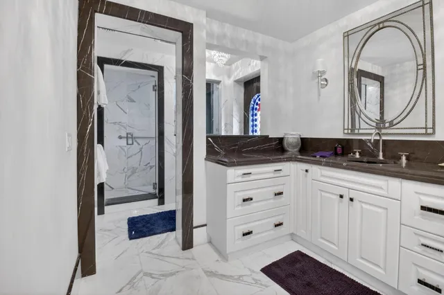 a living room with furniture a flat screen tv and a floor to ceiling window