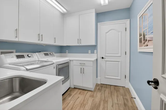 a view of a swimming pool with a table and a chair