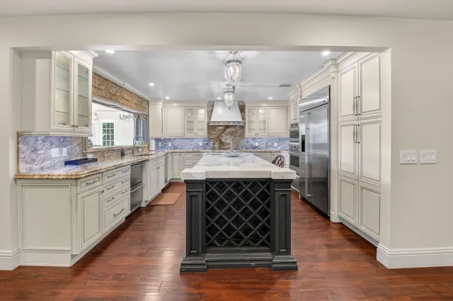 a kitchen with counter top space cabinets and stainless steel appliances