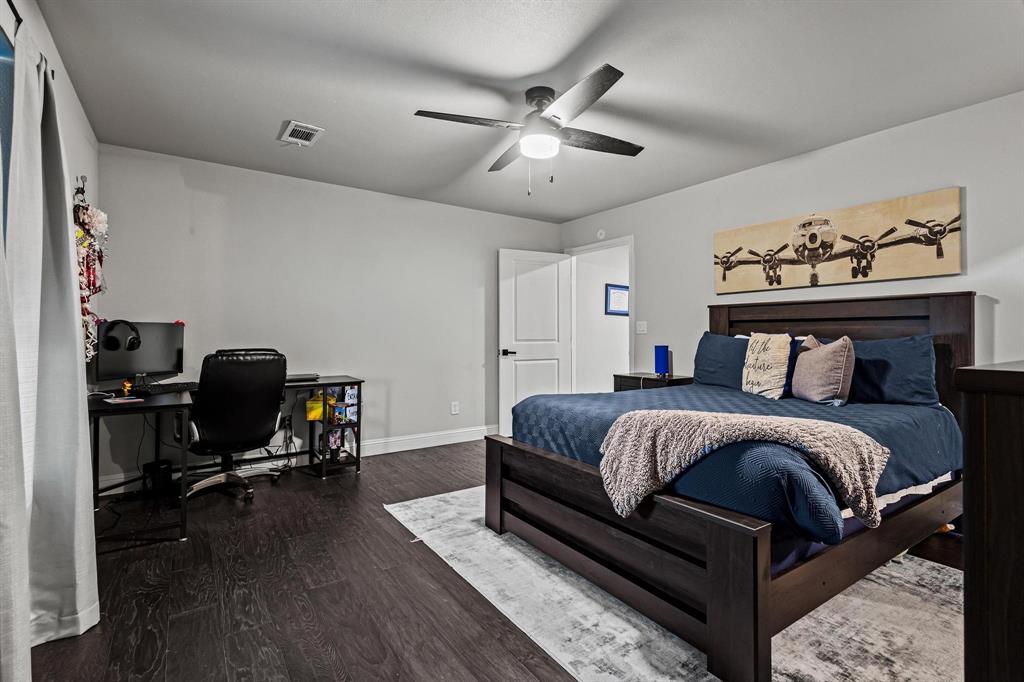 979 Mitchell Road Sherman, TX 75090 - Photo 24 of 40 Bedroom featuring dark wood finished floors, an office area, and ceiling fan