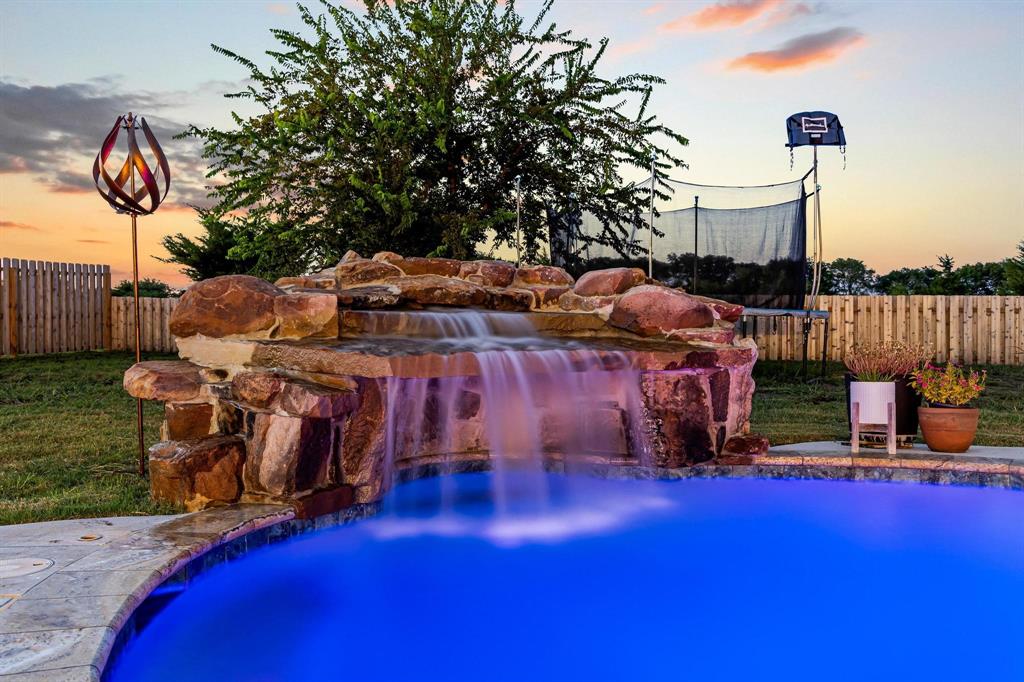 979 Mitchell Road Sherman, TX 75090 - Photo 30 of 40 View of swimming pool featuring a patio area and a trampoline