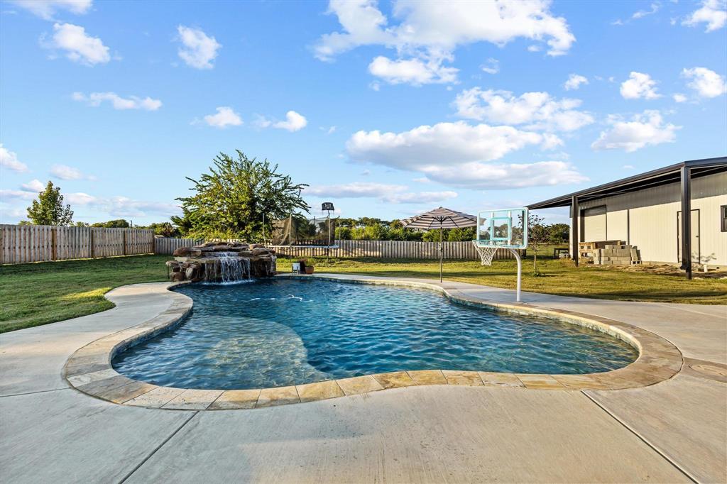 979 Mitchell Road Sherman, TX 75090 - Photo 31 of 40 Bathroom with vanity, light marble finish flooring, and a shower with shower curtain