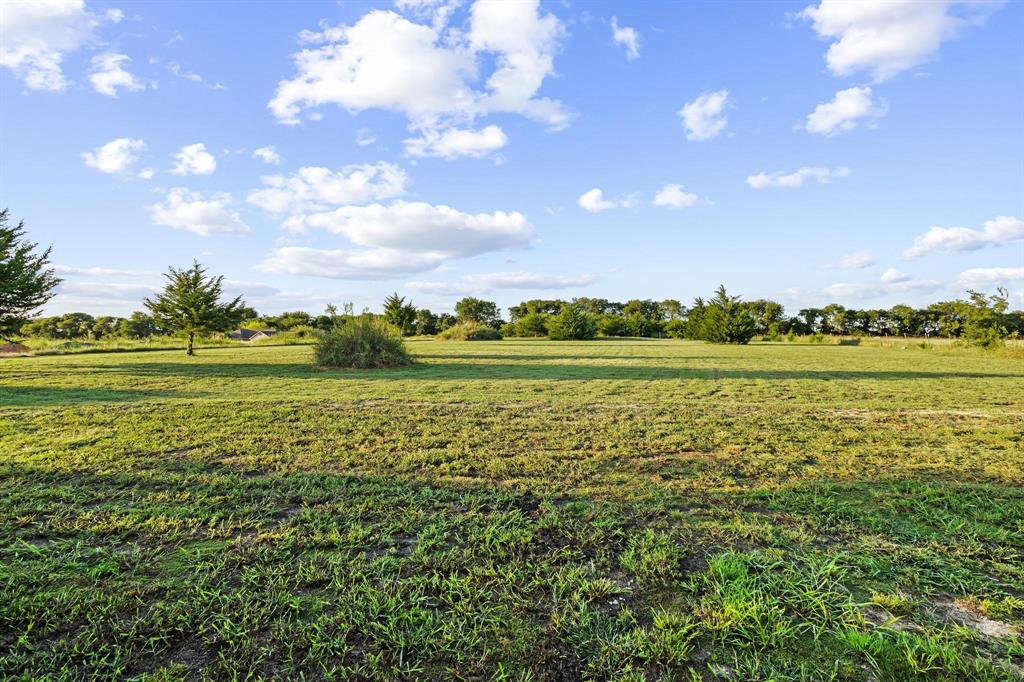 979 Mitchell Road Sherman, TX 75090 - Photo 38 of 40 View of grassy yard featuring a rural view