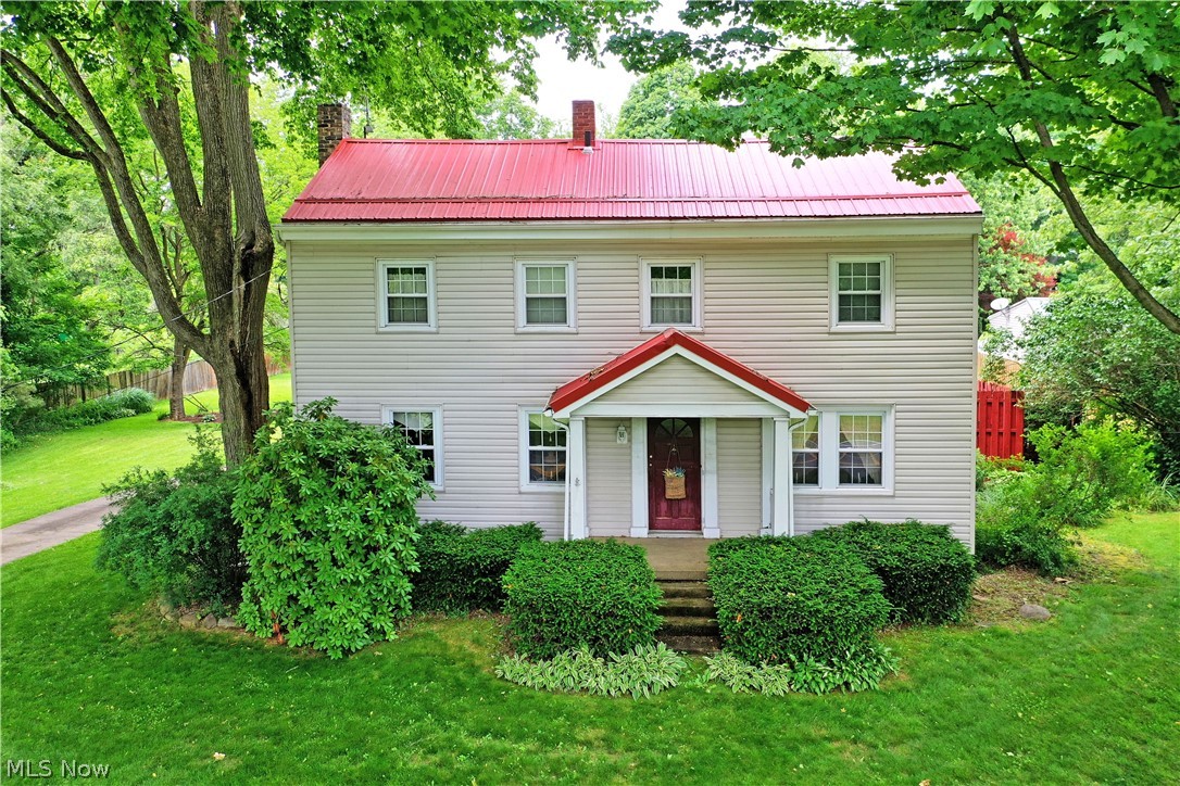 8683 King Graves Road Northeast Warren, OH 44484 - Photo 2 of 50 Two-story residence featuring light-colored siding and a distinctive red metal roof