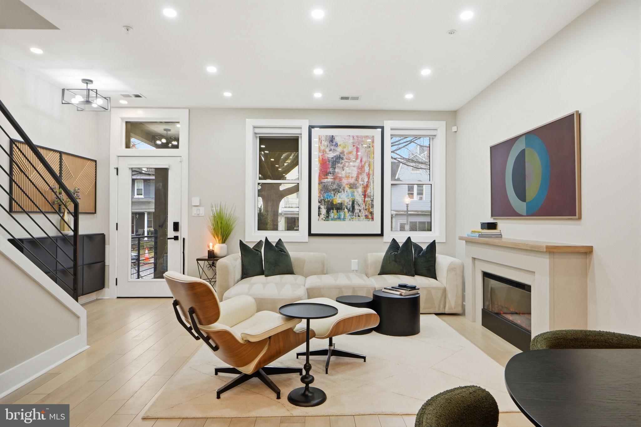 533 Shepherd Street Northwest Washington, DC 20011 - Photo 13 of 69 a living room with furniture a flat screen tv and a fireplace