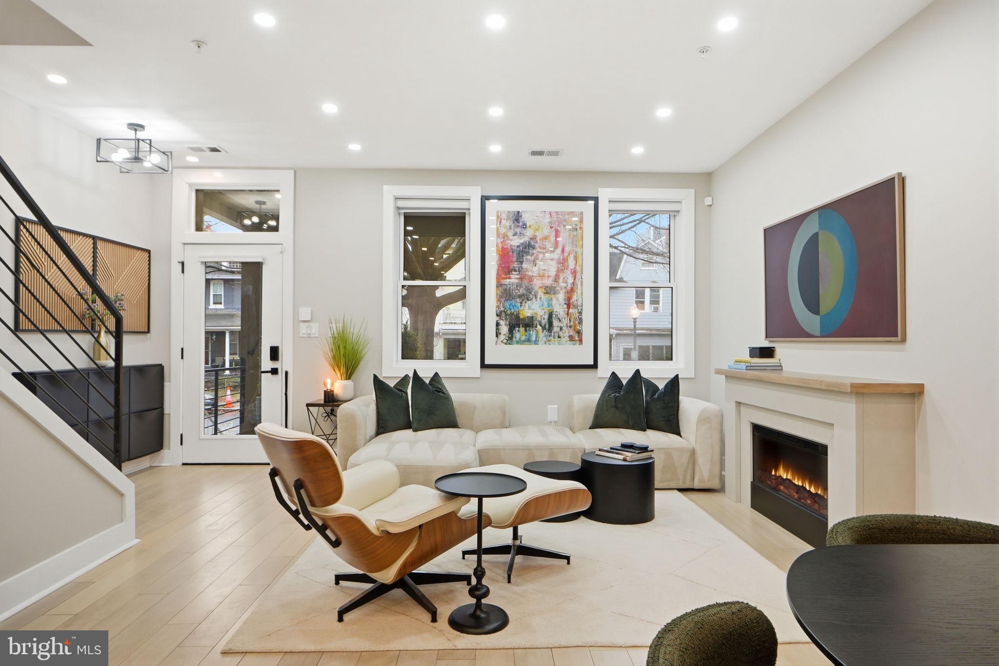 533 Shepherd Street Northwest Washington, DC 20011 - Photo 14 of 69 a living room with furniture a flat screen tv and a fireplace