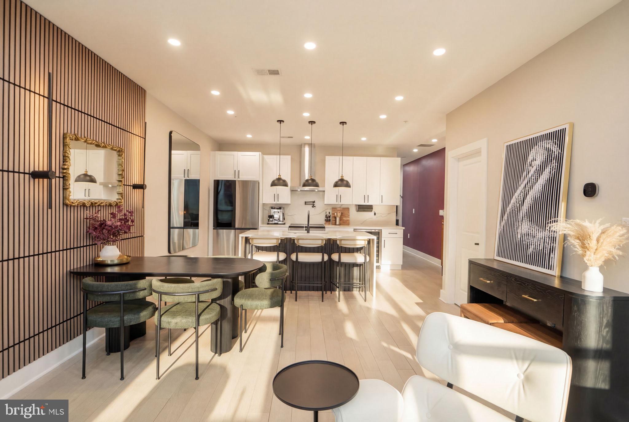 533 Shepherd Street Northwest Washington, DC 20011 - Photo 17 of 69 a kitchen with stainless steel appliances kitchen island granite countertop a refrigerator and a dining table
