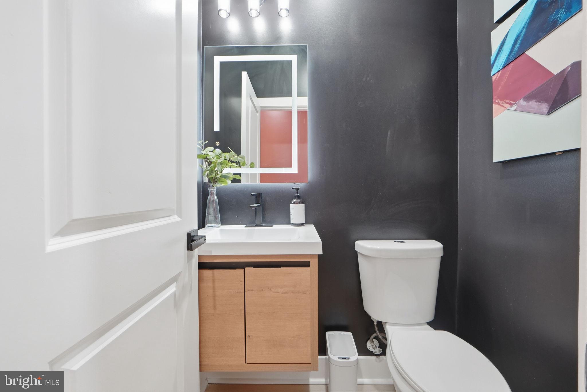 533 Shepherd Street Northwest Washington, DC 20011 - Photo 25 of 69 a white toilet sitting next to a bathroom sink