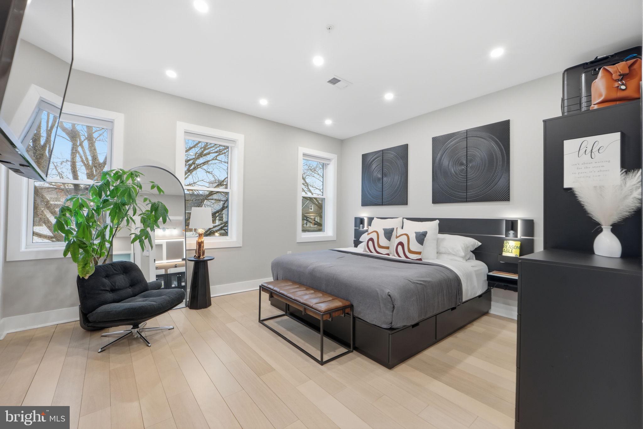 533 Shepherd Street Northwest Washington, DC 20011 - Photo 26 of 69 a spacious bedroom with a bed and a couch