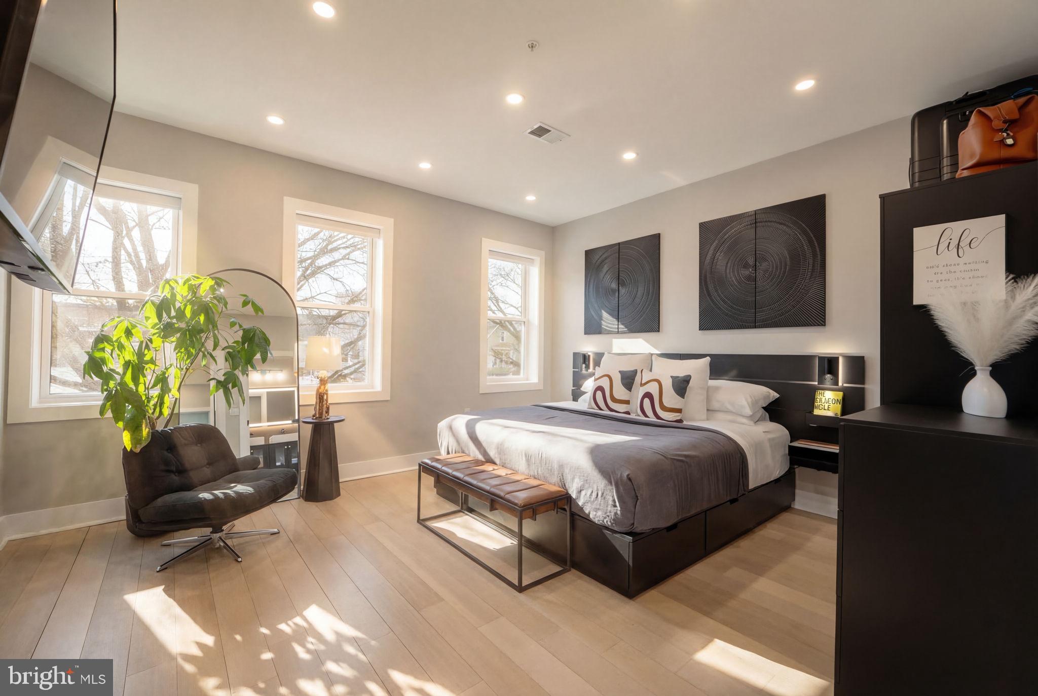533 Shepherd Street Northwest Washington, DC 20011 - Photo 27 of 69 a spacious bedroom with a bed and a couch