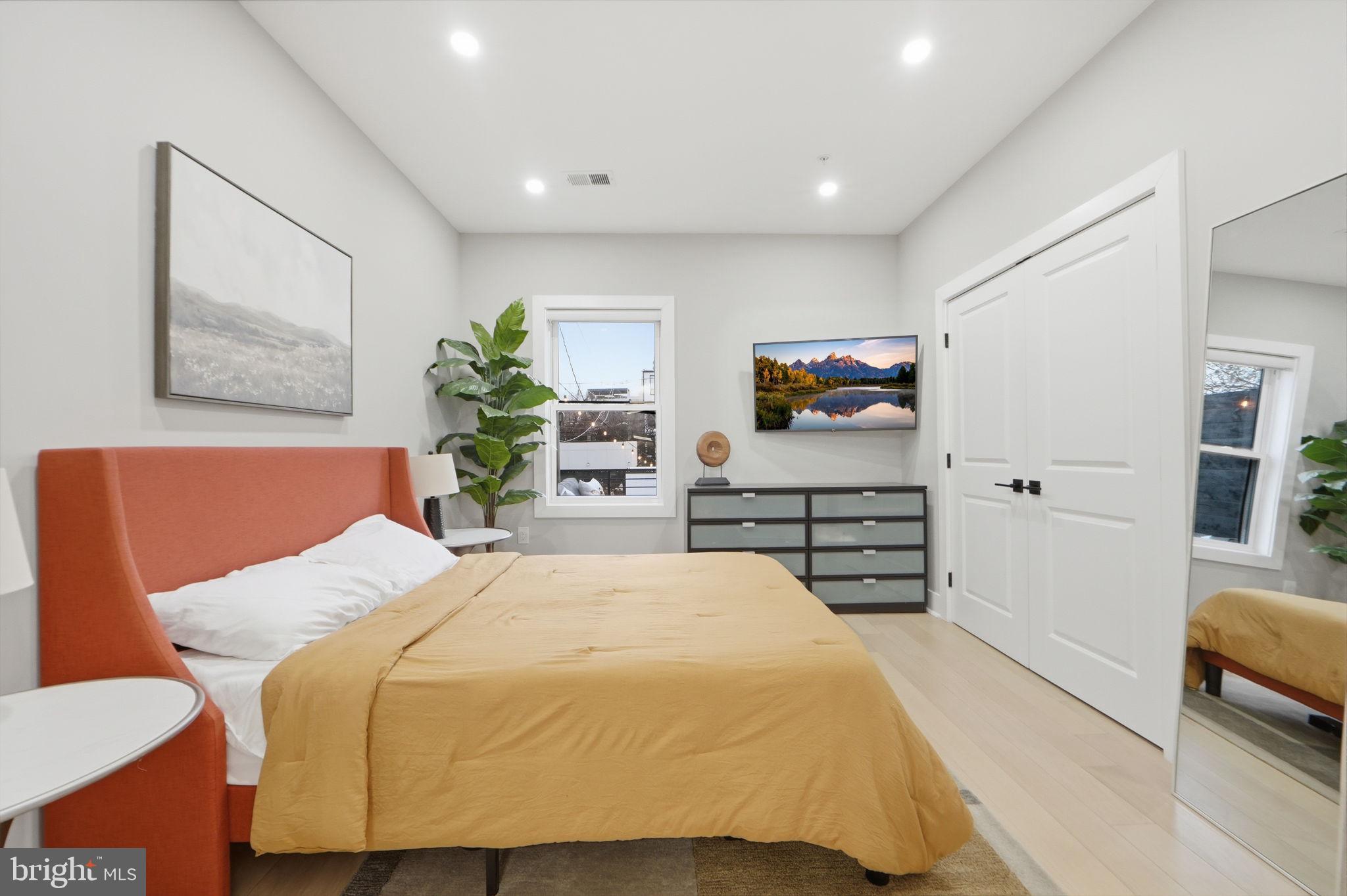 533 Shepherd Street Northwest Washington, DC 20011 - Photo 33 of 69 a bedroom with a bed and a couch