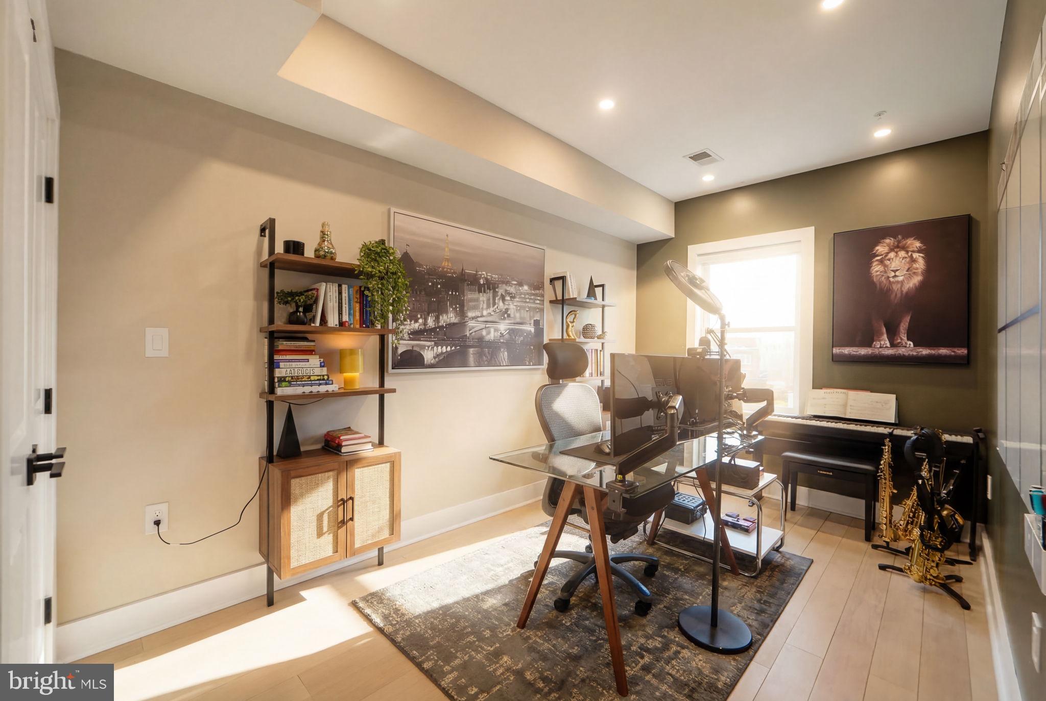 533 Shepherd Street Northwest Washington, DC 20011 - Photo 41 of 69 a workspace with wooden floor and furniture