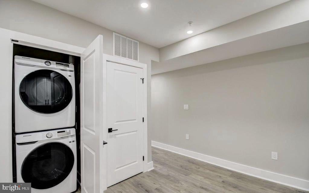 533 Shepherd Street Northwest Washington, DC 20011 - Photo 51 of 69 a view of a hallway with washer and dryer