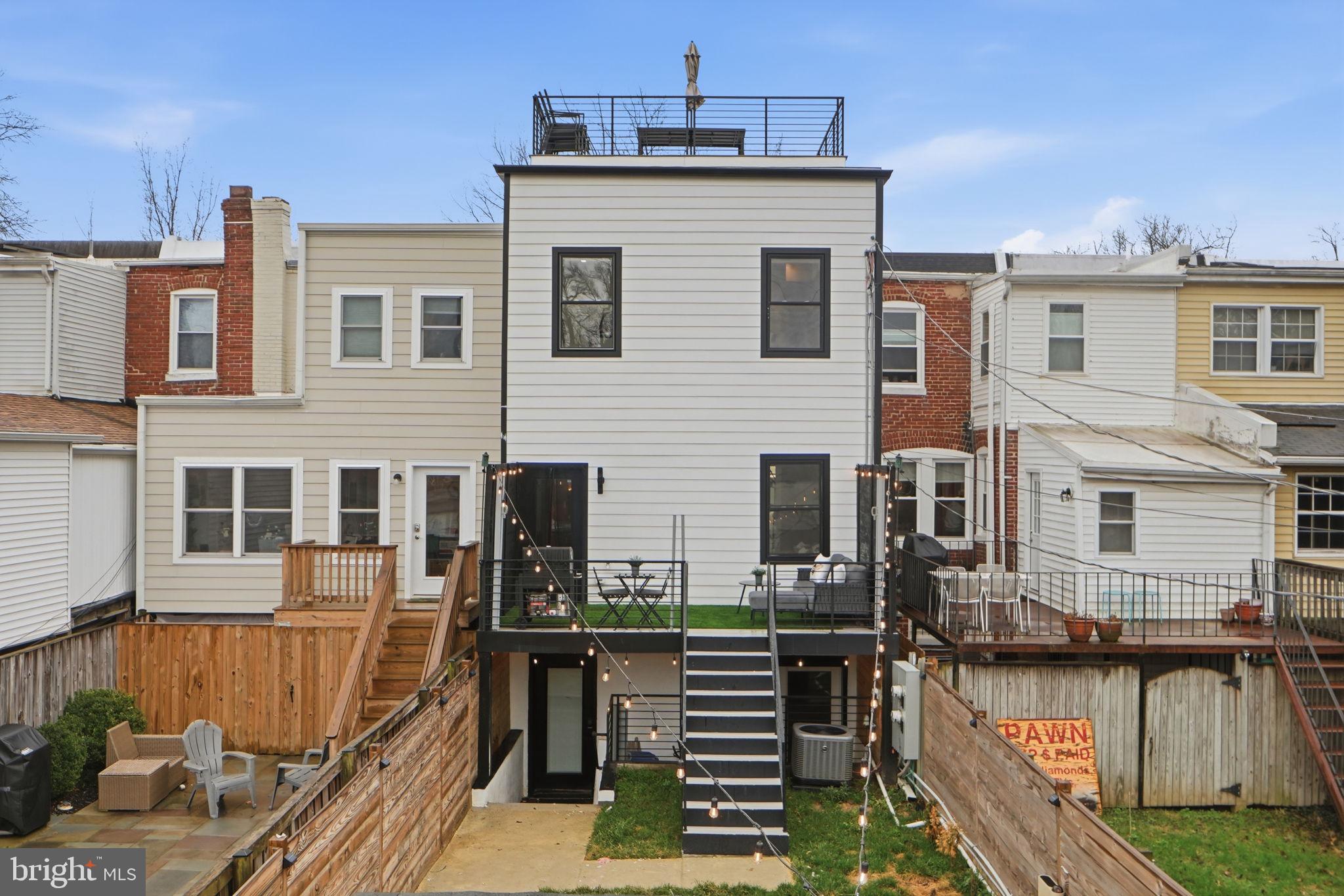 533 Shepherd Street Northwest Washington, DC 20011 - Photo 66 of 69 a view of a house with wooden deck and furniture