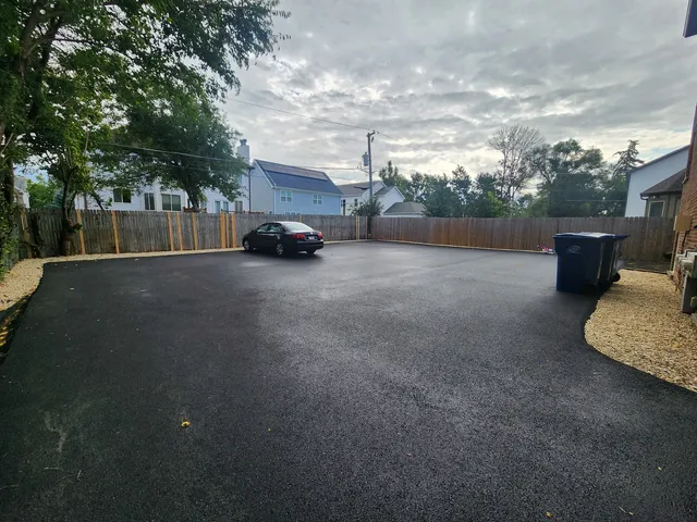 a couple of cars parked in front of a house