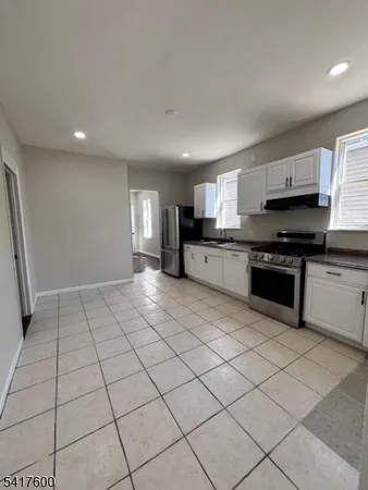 a view of a kitchen with electric appliances