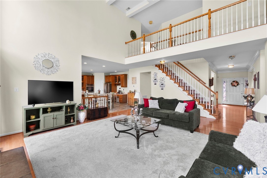 753 Blossom Tree Road Culpeper, VA 22701 - Photo 22 of 68 Two-story living room featuring a vaulted ceiling